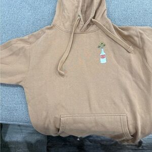 Stylish Tan Hoodie with Bottle Design
